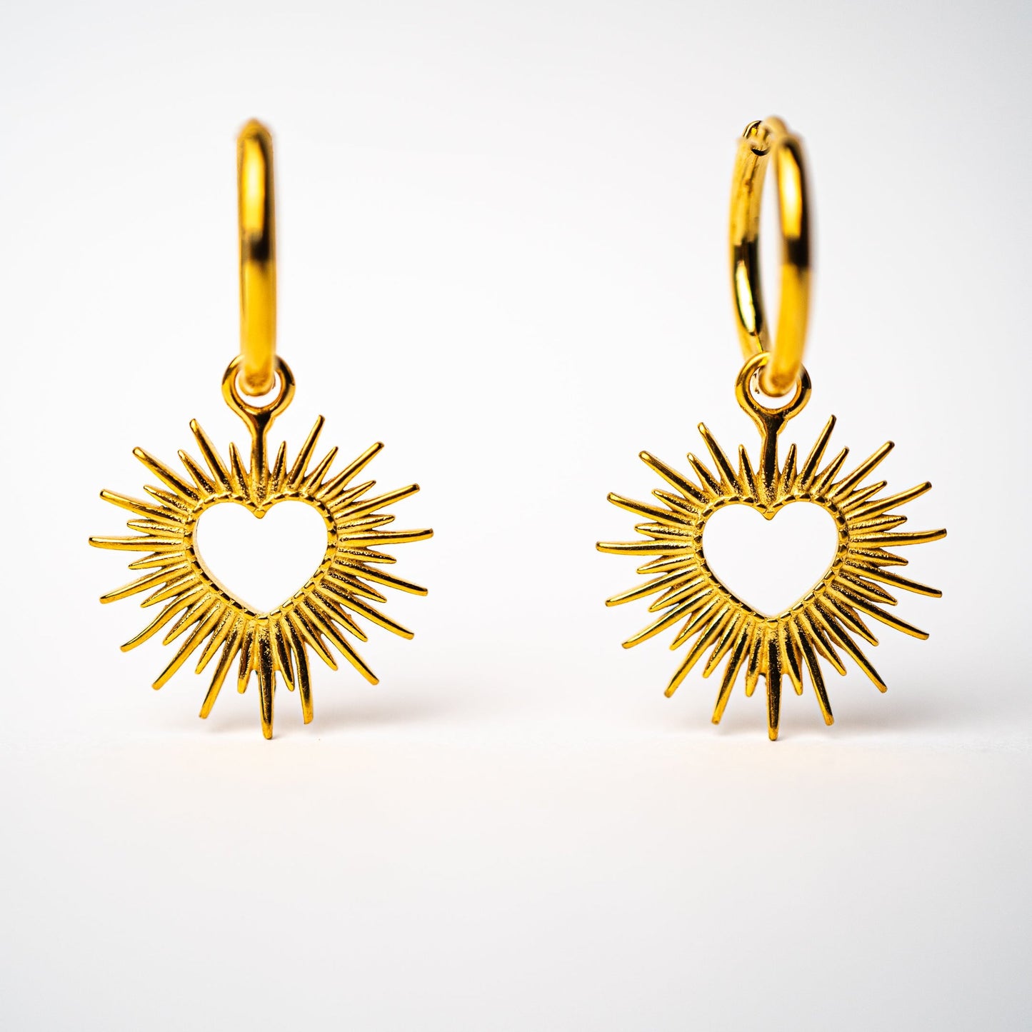 Lula Sea Jewellery, Romeo & Juliet heart drops, gold plated hoop earrings, with pendant drops, hearts with golden metal rays shining out from the central heart shape, Lula Sea Jewellery New Zealand